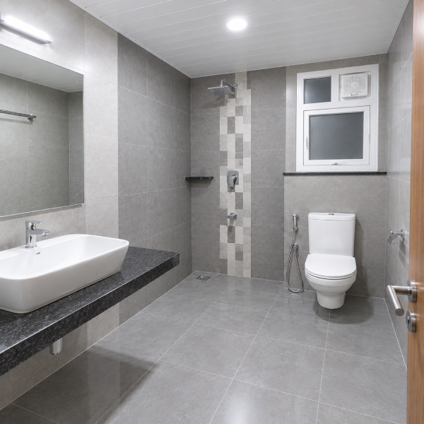 Modern bathroom, clean bathroom space, stylish bathroom interior, rental room bathroom, shared accommodation bathroom, bathroom for working professionals, bathroom for students, comfortable rental living, hygienic bathroom, well-maintained bathroom, spacious bathroom, modern wash basin, ceramic wash basin, bathroom vanity, granite countertop, western toilet, clean toilet area, tiled bathroom, grey tile bathroom, contemporary bathroom design, residential bathroom, apartment bathroom, rental accommodation, student accommodation, professional accommodation, affordable room rental, comfortable room facilities, private bathroom, shared bathroom facility, well-equipped bathroom, bathroom amenities, functional bathroom, neat washroom, spacious washroom, modern washroom, bathroom with storage, bathroom mirror, bathroom sink, bathroom fixtures, quality bathroom fittings, clean living space, convenient accommodation, furnished rental room, comfortable stay, home-like accommodation, bachelor accommodation, student-friendly accommodation, working professional accommodation, premium room facilities, ready-to-move accommodation, modern rental property.